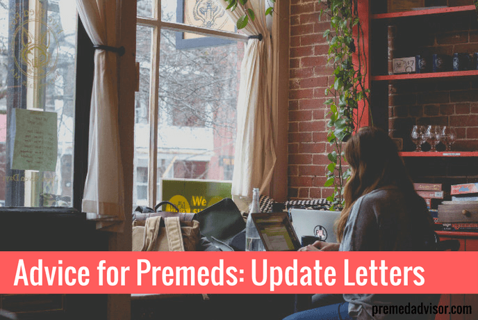 Woman typing medical school update letter in a coffee shop